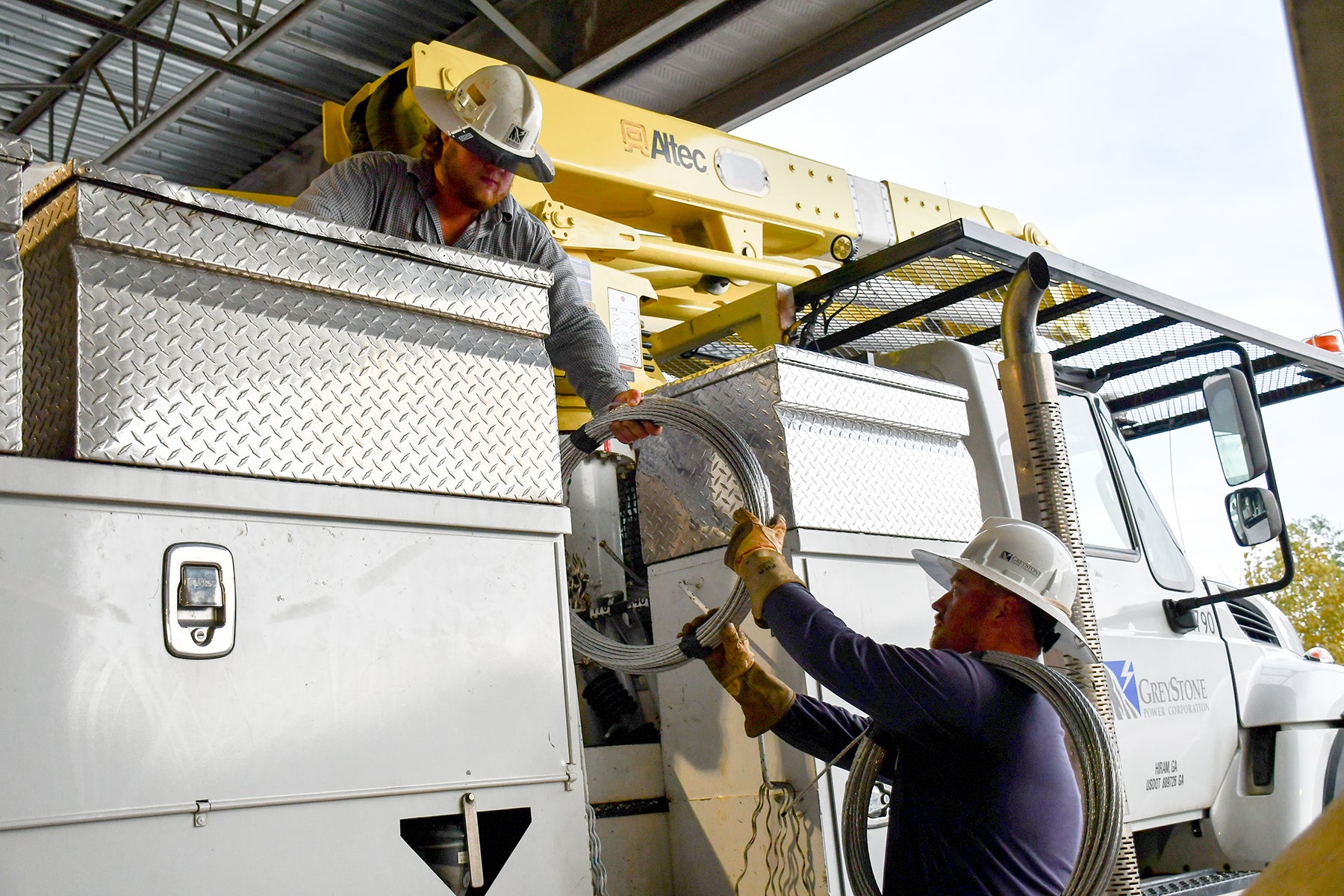 Linemen make preparations for possible outages.  